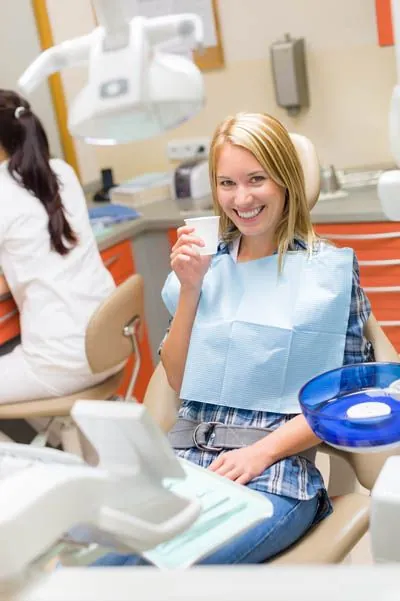 woman about to take a sedative prior to her dental procedure